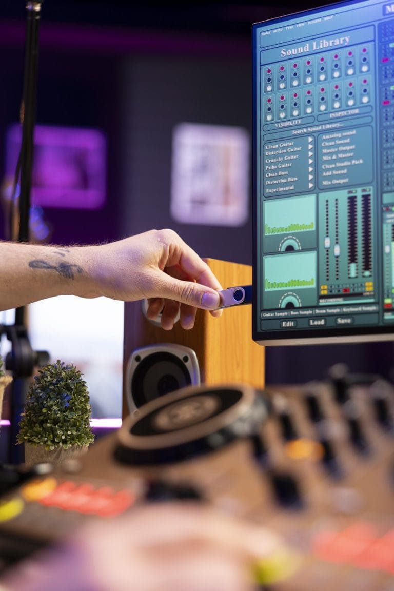 Producer editing recorded audio files in the studio