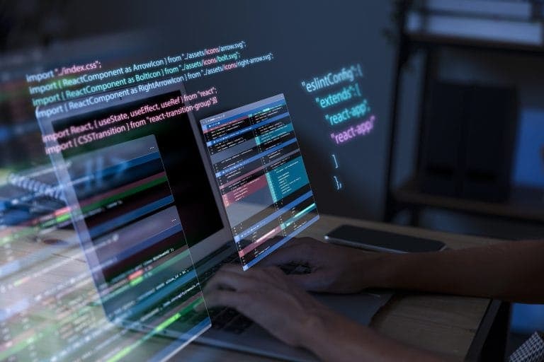Developer writing code on a computer