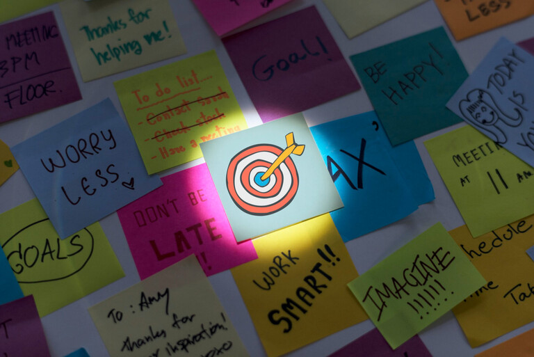 A dynamic split-screen image showing a creative marketing team brainstorming with AI-powered digital interfaces and trending social media content on screens, representing the fusion of human creativity and technology in modern marketing strategy.